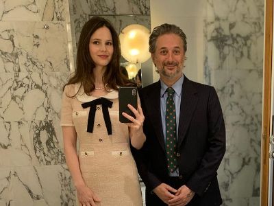 Both Rachel Korine and Harmony Korine are posing in front of washroom mirror as Rachel is taking a selfie.